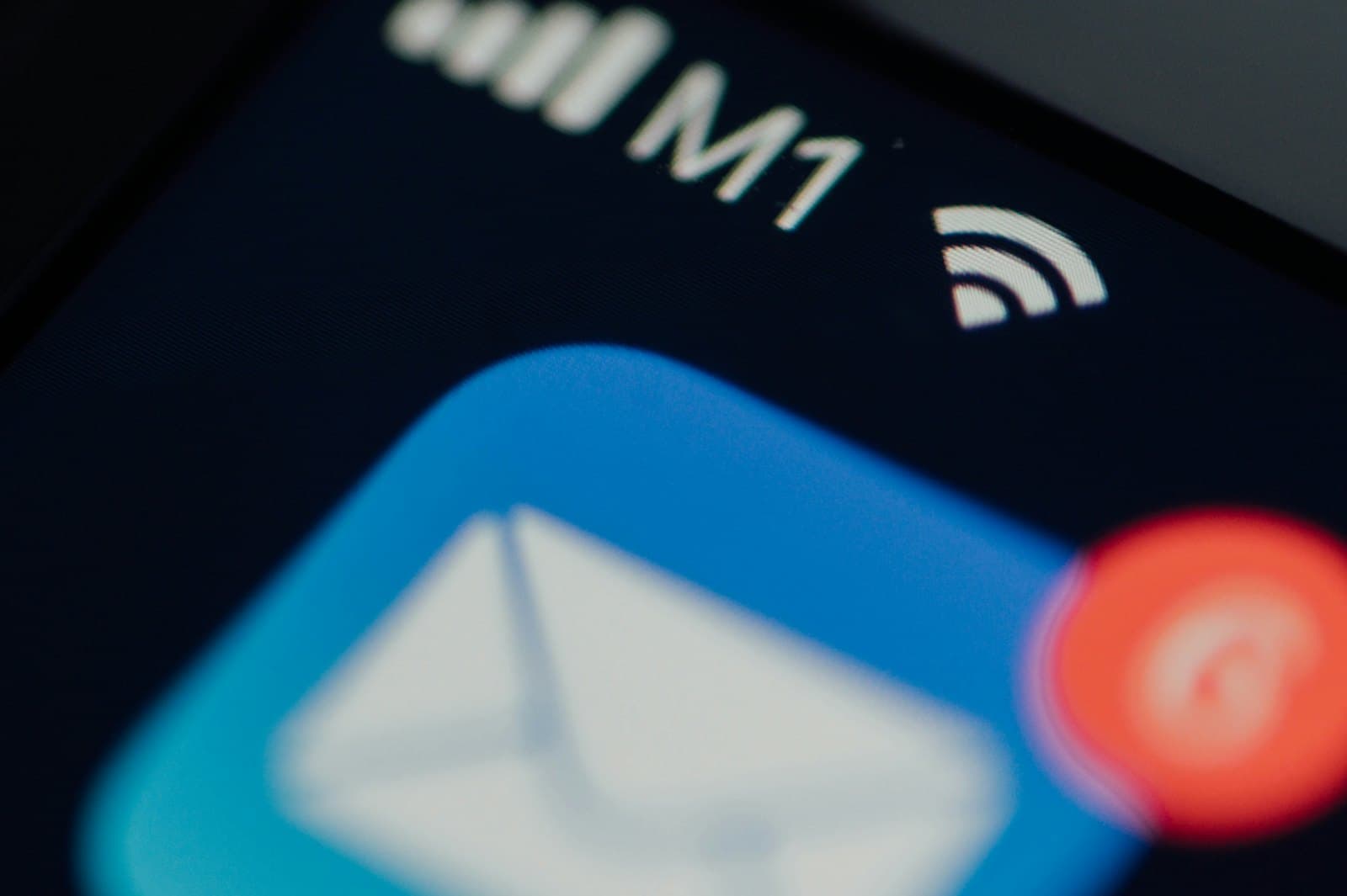 Close-up of a phone's mail app icon with unread notifications on the badge.